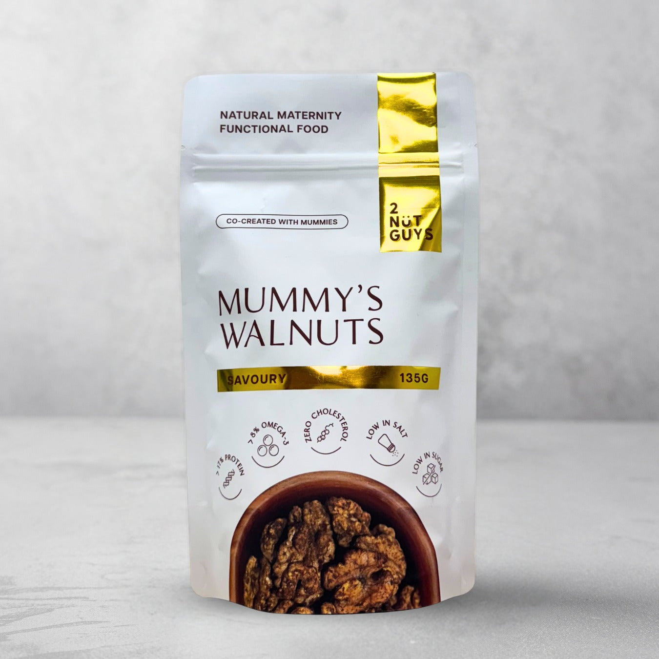 One pack of 2NUTGUYS Mummy's Walnuts - Savoury in marbled grey background.