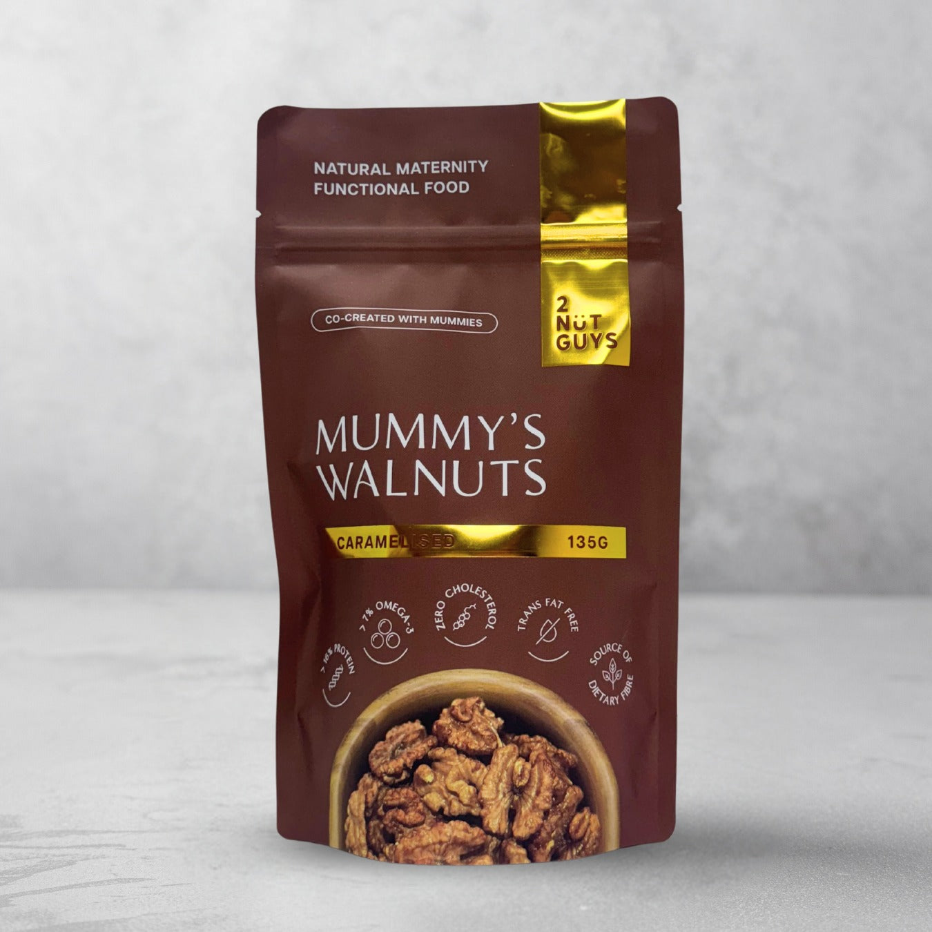 One pack of 2NUTGUYS Mummy's Granola - Caramelised in marbled grey background.