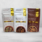 The packages of 2NUTGUYS Mummy's Walnuts - Savoury, Mummy's Walnuts - Caramelised, Mummy's Granola on a light grey background